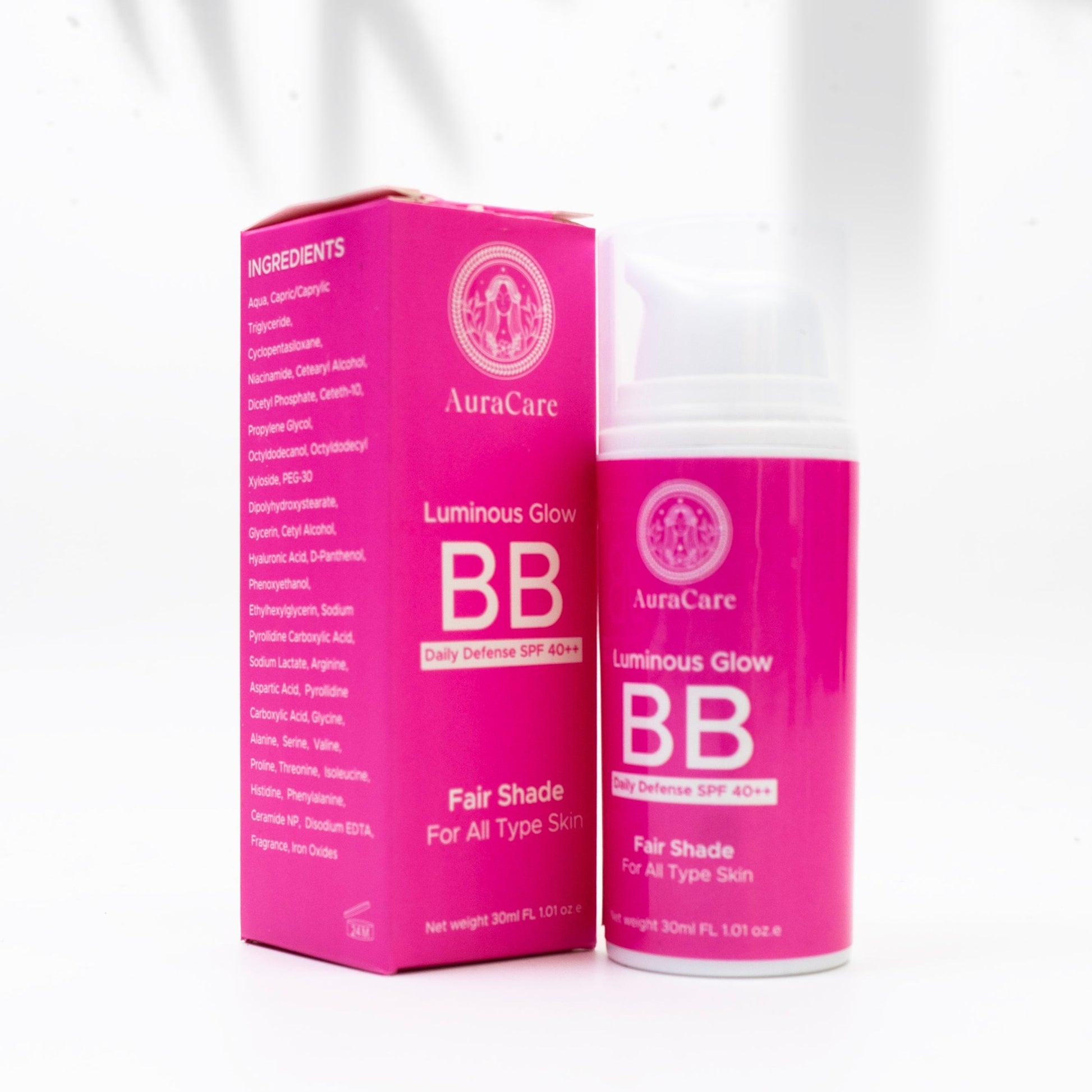 A BB cream product with SPF 40++, featuring a pink container and packaging, displayed on a white surface with a shadow cast over it.